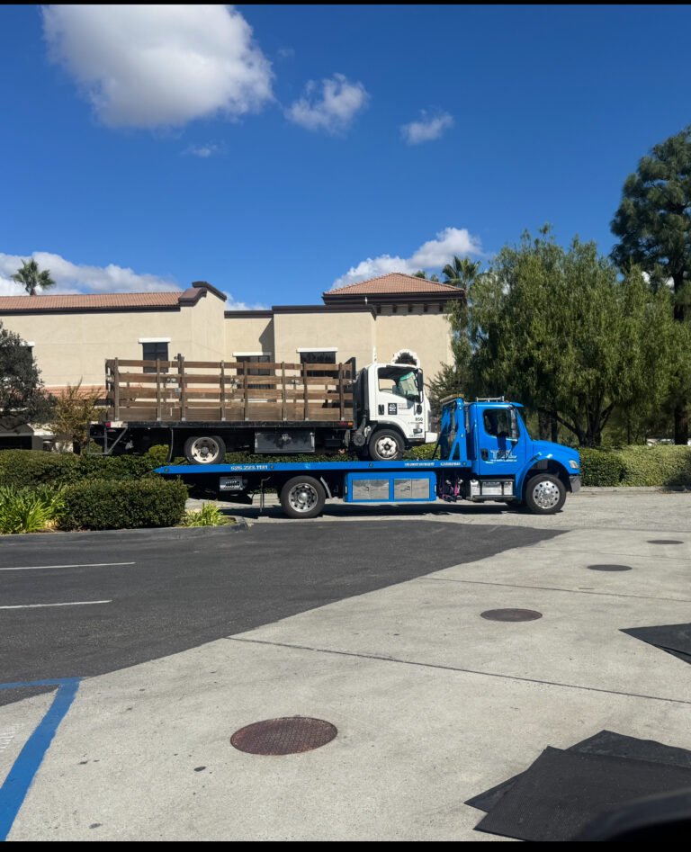Team Smith Logistics transporting industrial equipment on a flatbed