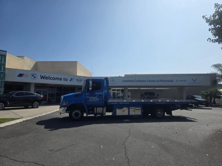 Team Smith Logistics flatbed outside the Certified Collision Center of Riverside