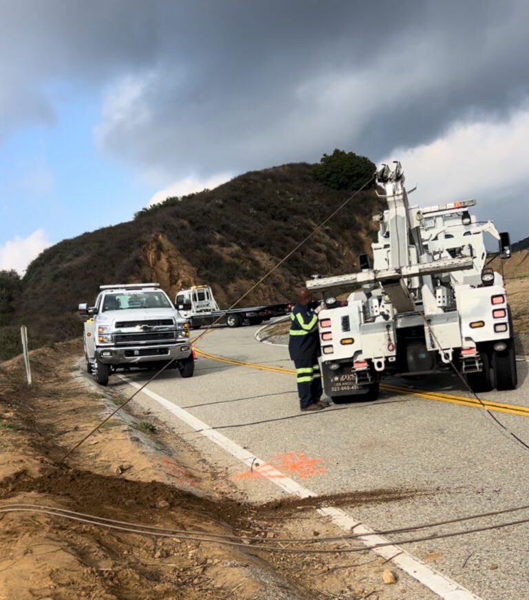 Team Smith Logistics recovery crew working a mountain roadside